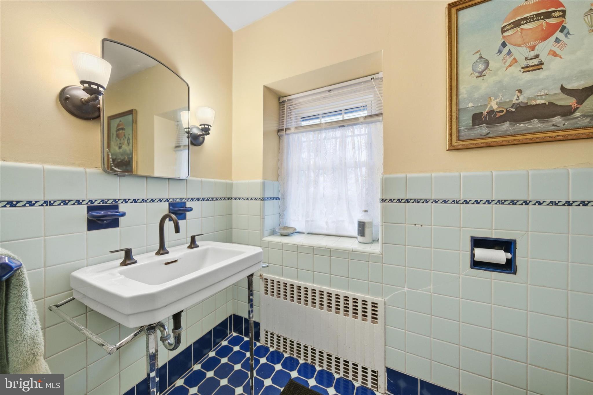 1711 Alsace Road Reading, PA 19604 - Photo 27 of 45 a bathroom with a sink and a mirror