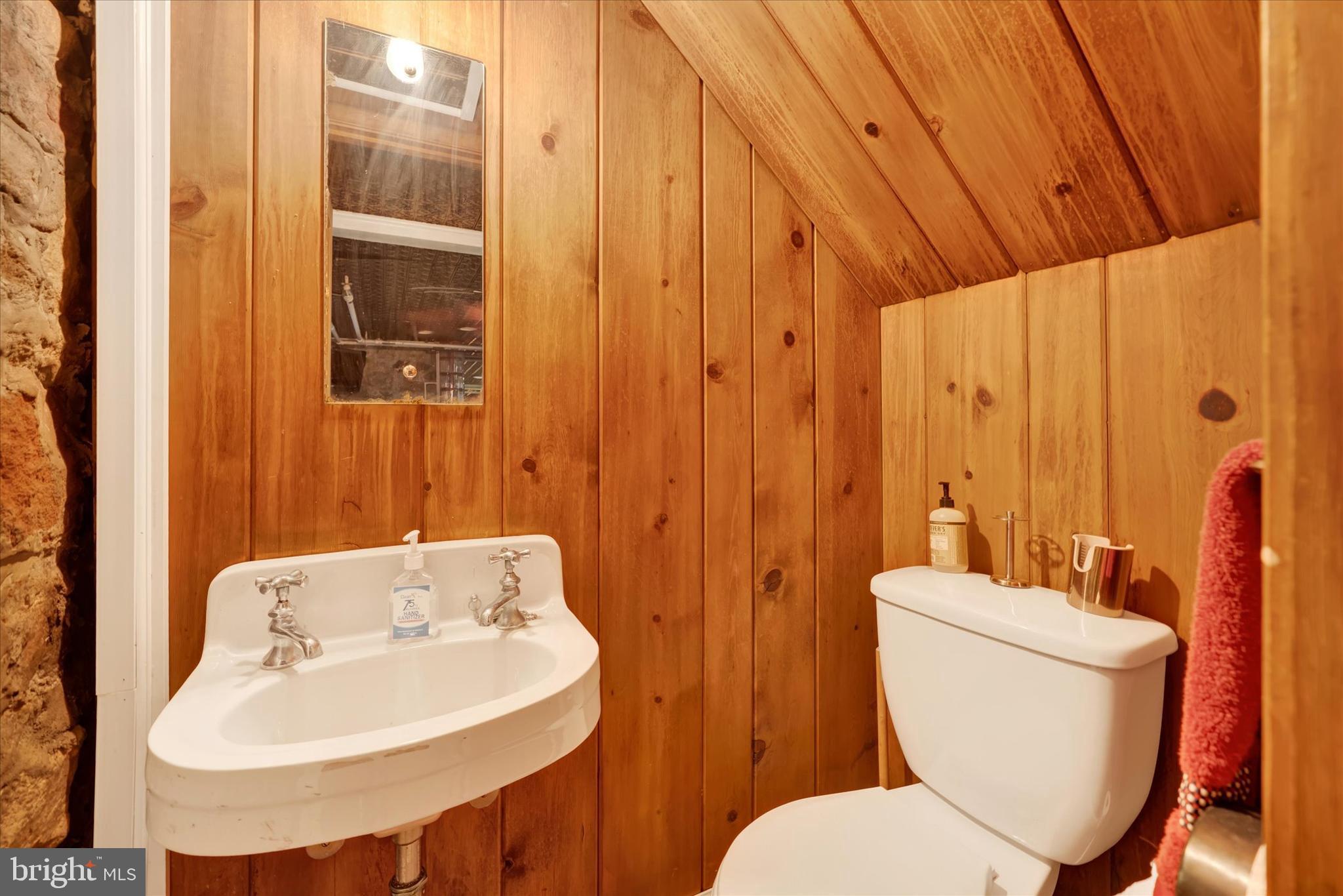 1711 Alsace Road Reading, PA 19604 - Photo 33 of 45 a bathroom with a toilet a sink and a mirror