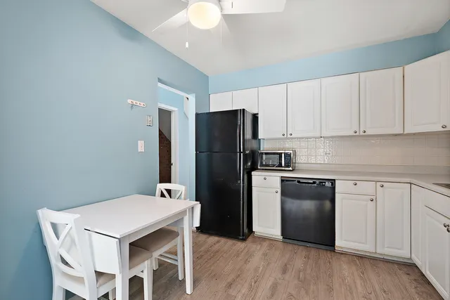 a kitchen with cabinets a sink and appliances