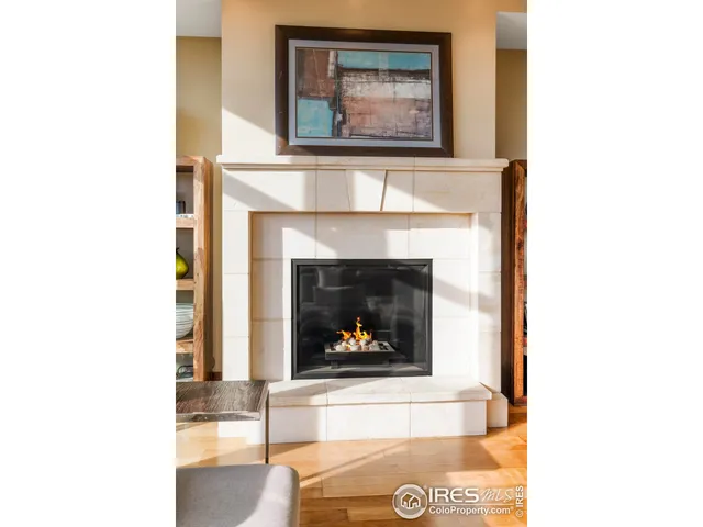 a living room with a fireplace and a fireplace