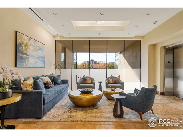 a dining room with furniture and a potted plant