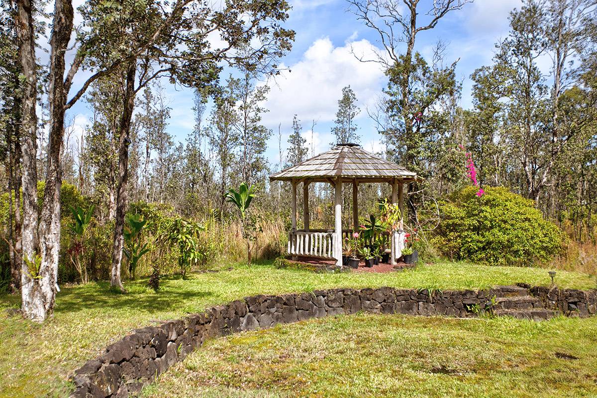16-2041 Opeapea Road Pahoa, HI 96778 - Photo 11 of 26 a view of a house with a yard