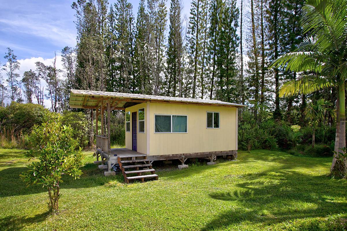 16-2041 Opeapea Road Pahoa, HI 96778 - Photo 12 of 26 a view of a backyard with plants and large trees