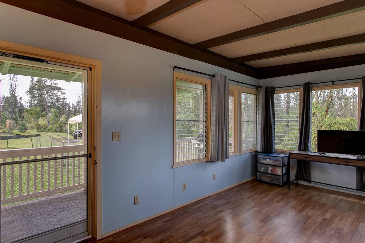 16-2041 Opeapea Road Pahoa, HI 96778 - Photo 16 of 26 a view of room with wooden floor and furniture