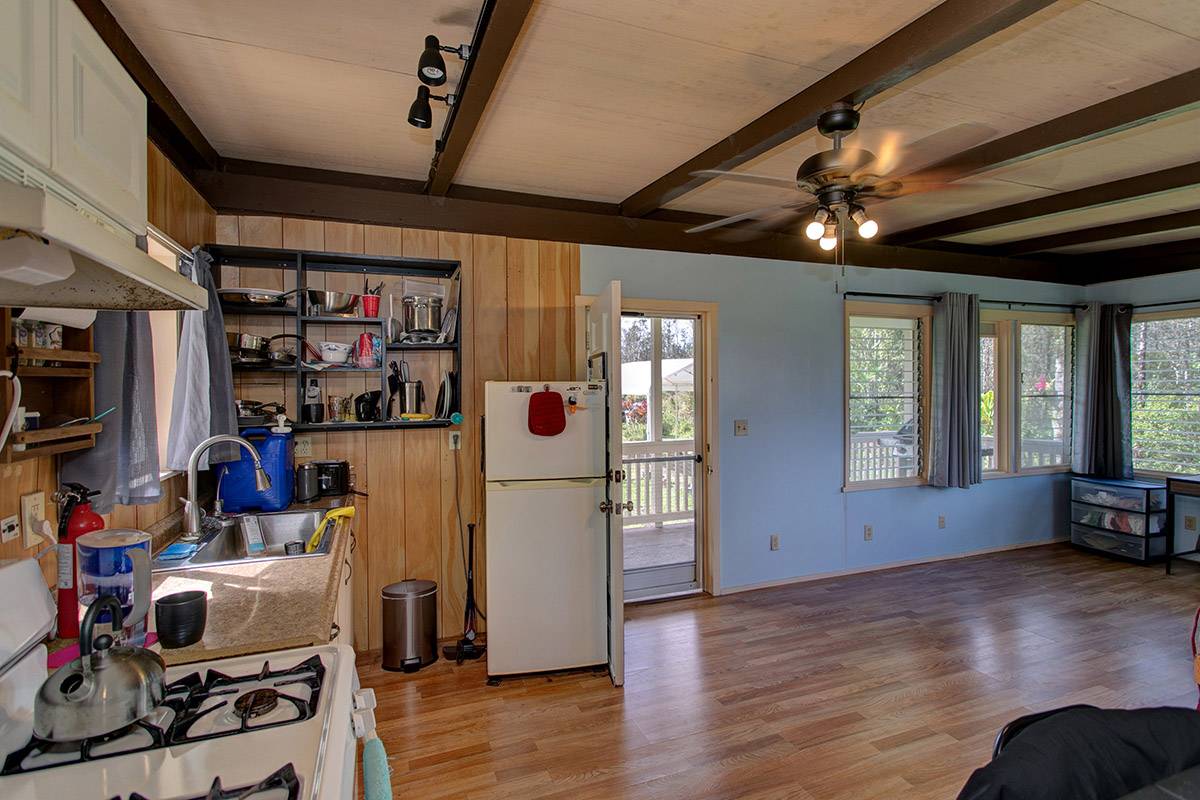 16-2041 Opeapea Road Pahoa, HI 96778 - Photo 20 of 26 a view of a room with workspace and wooden floor