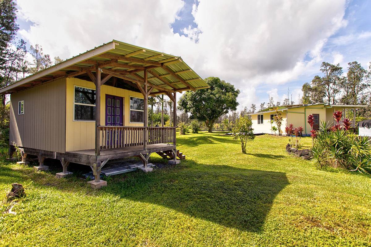 16-2041 Opeapea Road Pahoa, HI 96778 - Photo 10 of 26 a view of a house with swimming pool and sitting area