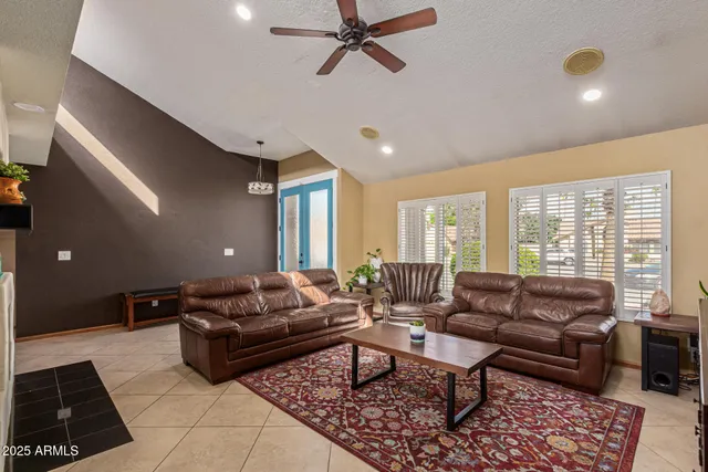 a living room with furniture and a rug