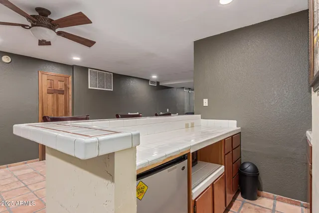 a bathroom with a sink a mirror and shower