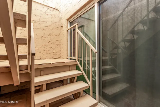 an aerial view of a residential houses with outdoor space and street view