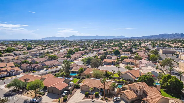 a front view of a house with a yard and a garage
