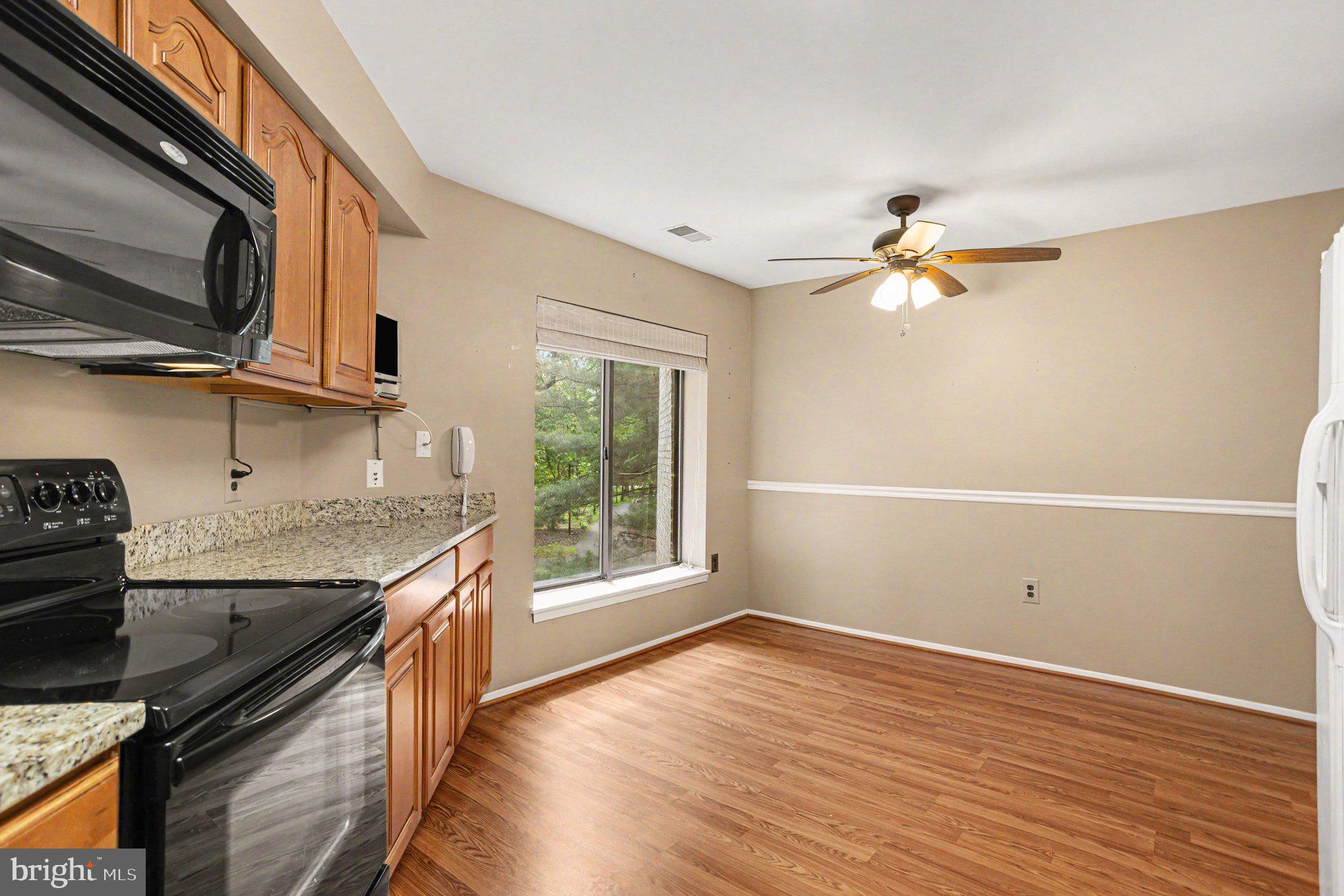3021 Fallstaff Road, Unit 208B Baltimore, MD 21209 - Photo 12 of 25 a kitchen with a sink stainless steel appliances and cabinets
