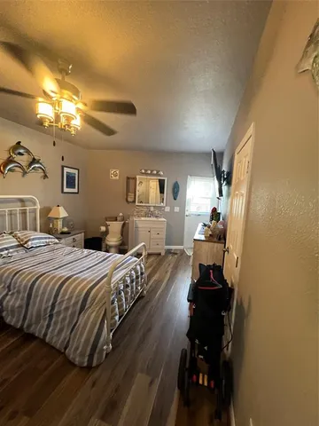 a bedroom with furniture and window