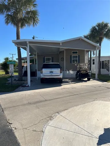 a view of a car parked in front of house