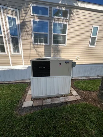 a view of a backyard with a garden and entertaining space