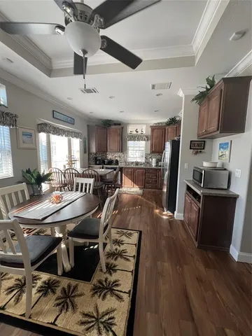 a view of a dining room with furniture and wooden floor
