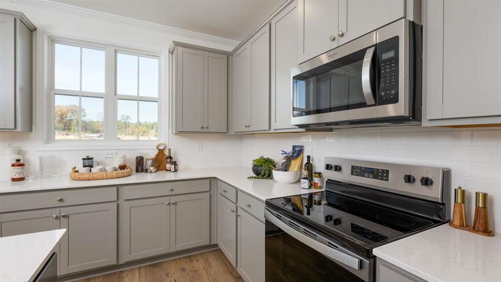 691 Alburgh Alley Mableton, GA 30126 - Photo 18 of 37 a kitchen with cabinets appliances and a window