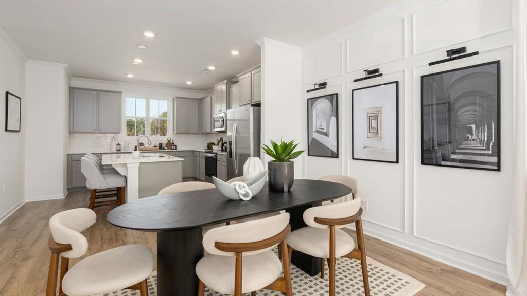 691 Alburgh Alley Mableton, GA 30126 - Photo 19 of 37 a dining room with furniture and a potted plant