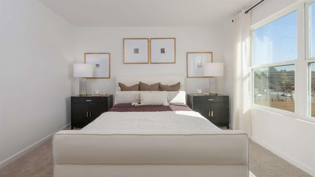 691 Alburgh Alley Mableton, GA 30126 - Photo 27 of 37 a bedroom with a bed and a window