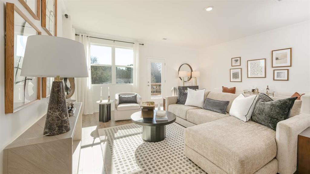 691 Alburgh Alley Mableton, GA 30126 - Photo 9 of 37 a living room with furniture and a large window
