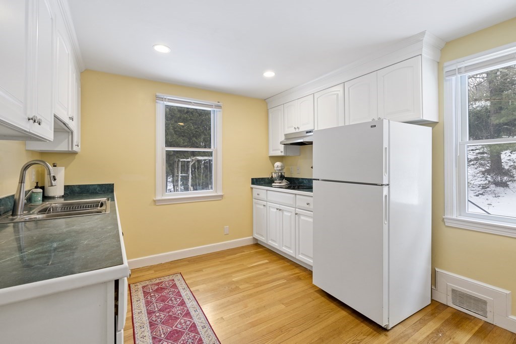 7 Longfellow Road Lexington, MA 02420 - Photo 14 of 30 a kitchen with a refrigerator and a sink