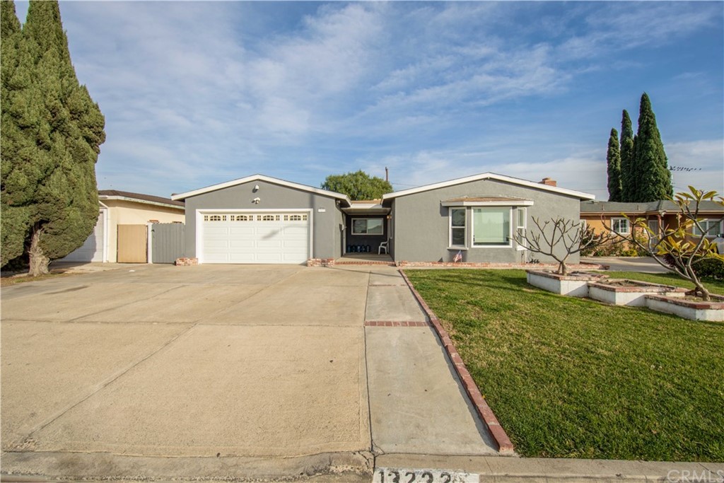 13232 Rockinghorse Road Garden Grove, CA 92843 - Photo 1 of 1 a view of residential houses with yard and mountain view in back