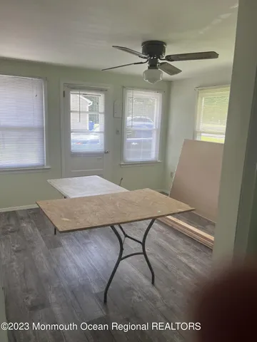 a view of a livingroom with furniture and window