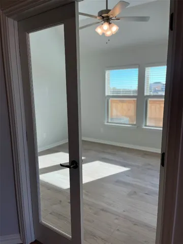 a view of an empty room and window