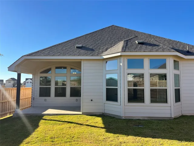 a view of house with door and outdoor space