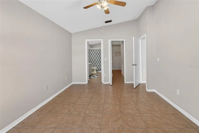 a bathroom with a sink a toilet and shower curtain