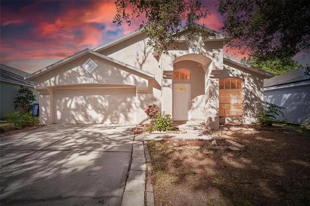 a view of a big yard with an outdoor space