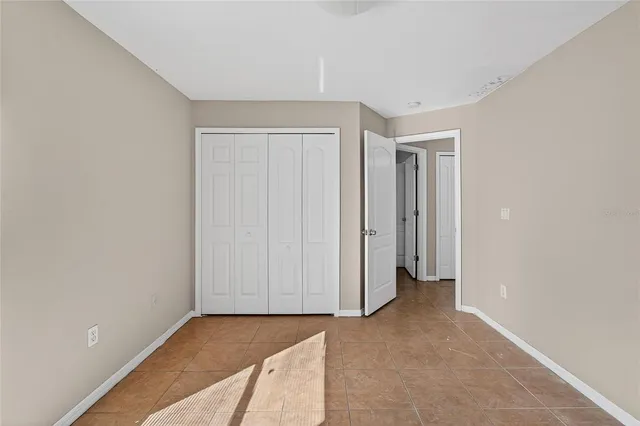 a bathroom with a sink a toilet and shower curtain