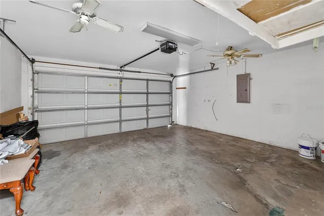 a view of a green field with wooden fence