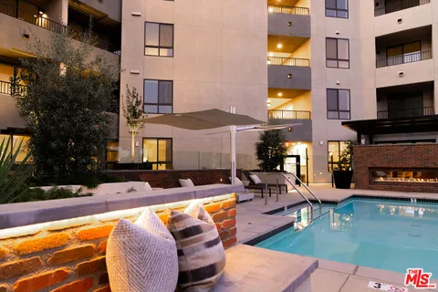 a view of a swimming pool with a patio