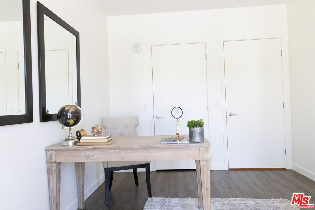 7566 West Sunset Boulevard, Unit 411PHE Los Angeles, CA 90046 - Photo 9 of 15 a view of a bathroom with a sink and a mirror