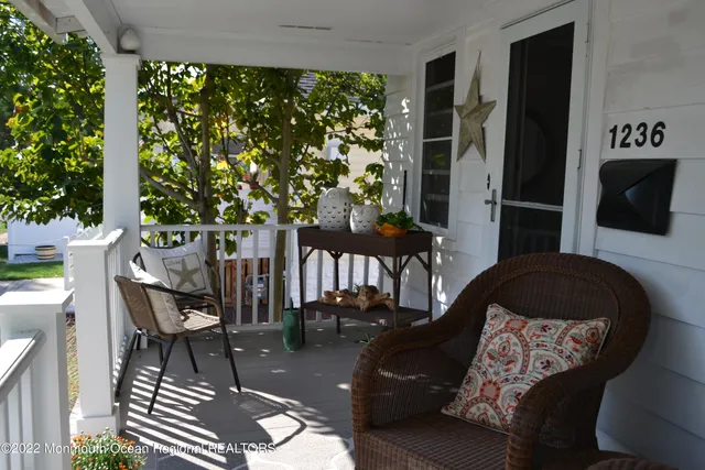 a balcony view with a outdoor seating space
