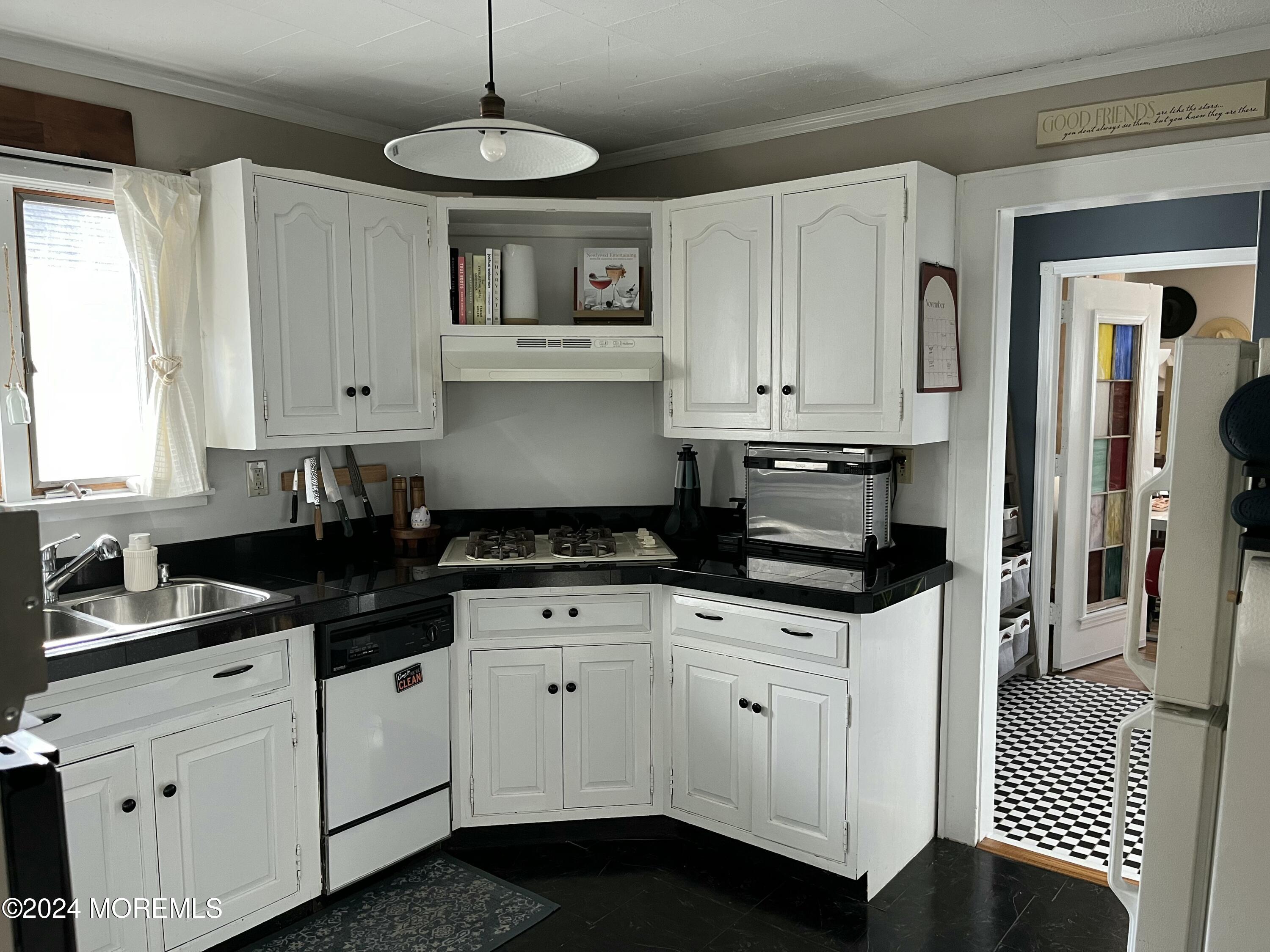 1236 Maplewood Road Belmar, NJ 07719 - Photo 17 of 38 a kitchen with granite countertop white cabinets and white appliances