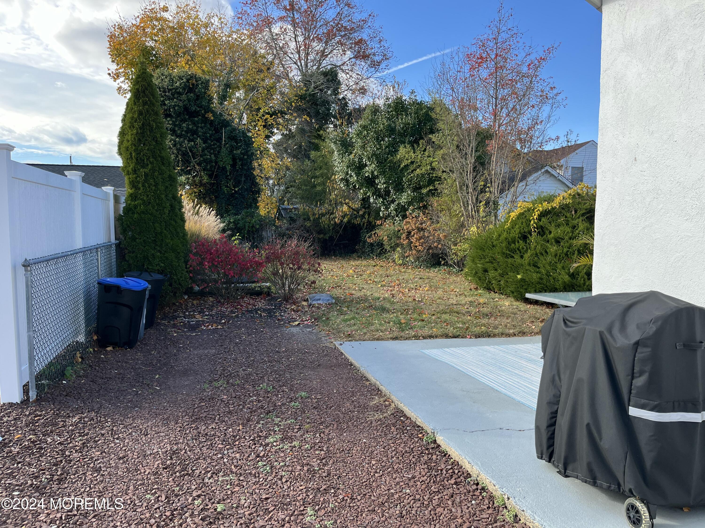 1236 Maplewood Road Belmar, NJ 07719 - Photo 31 of 38 a view of a backyard with plants and trees