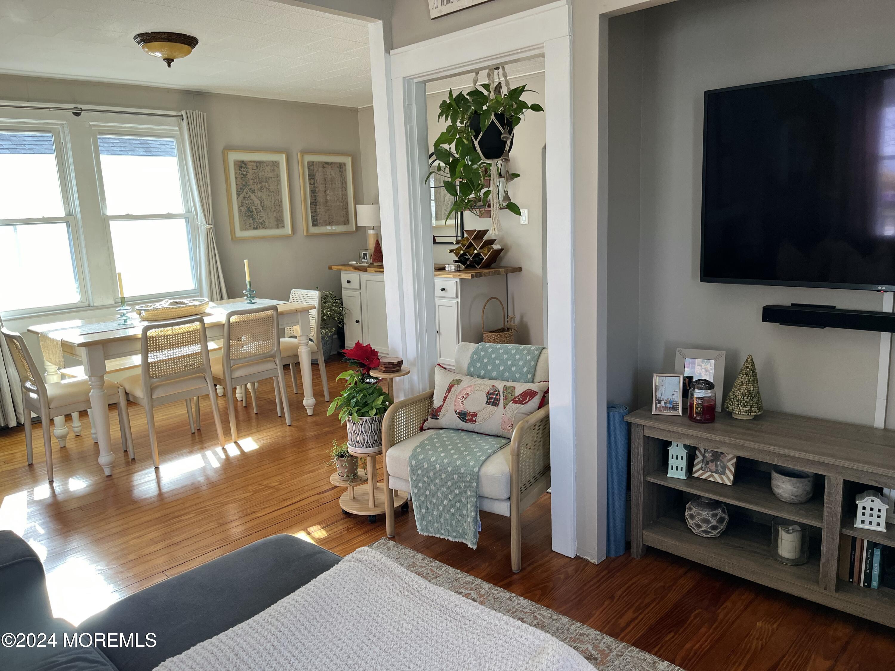 1236 Maplewood Road Belmar, NJ 07719 - Photo 4 of 38 a living room with furniture and a flat screen tv