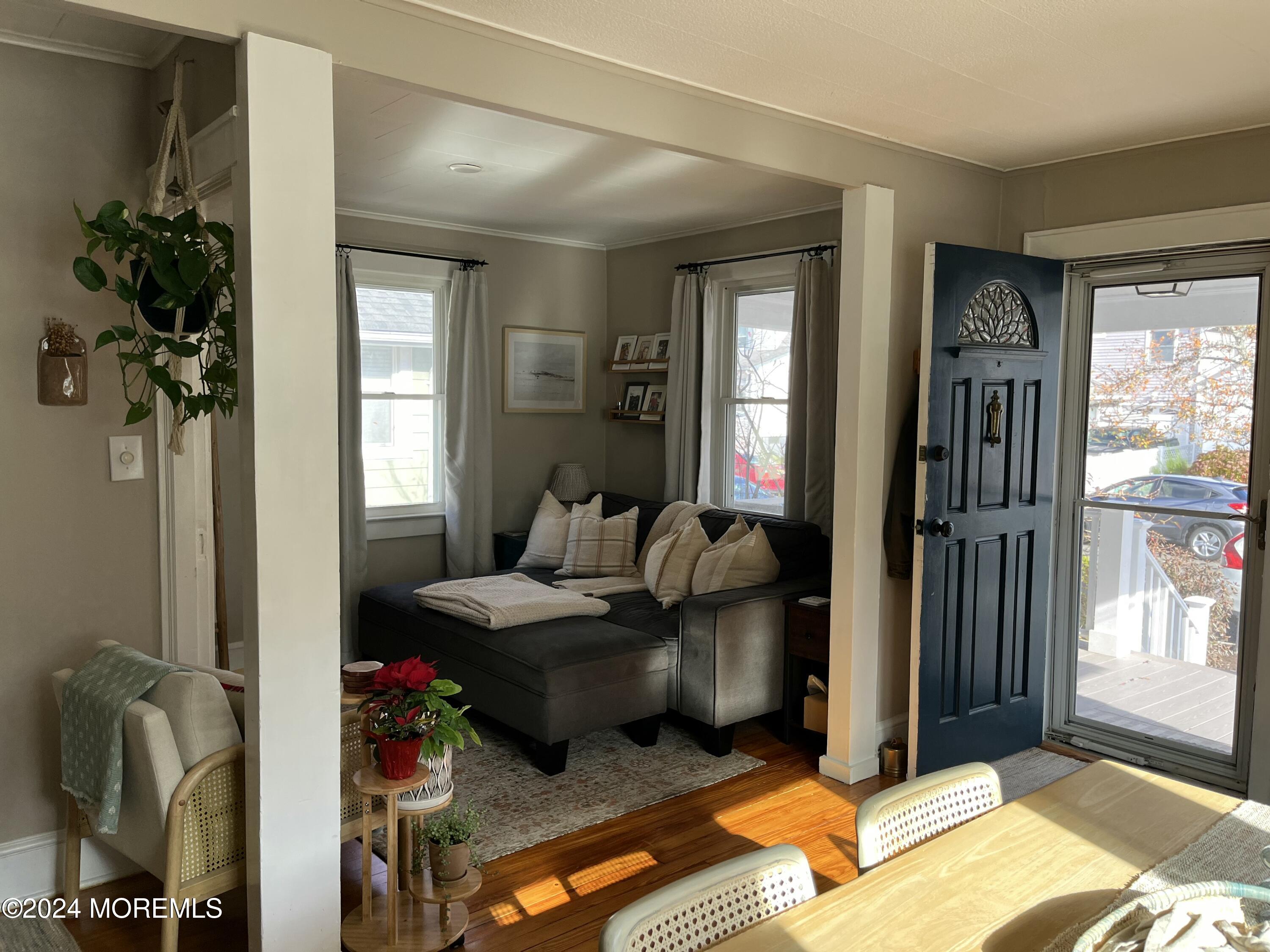 1236 Maplewood Road Belmar, NJ 07719 - Photo 8 of 38 a living room with furniture and a potted plant
