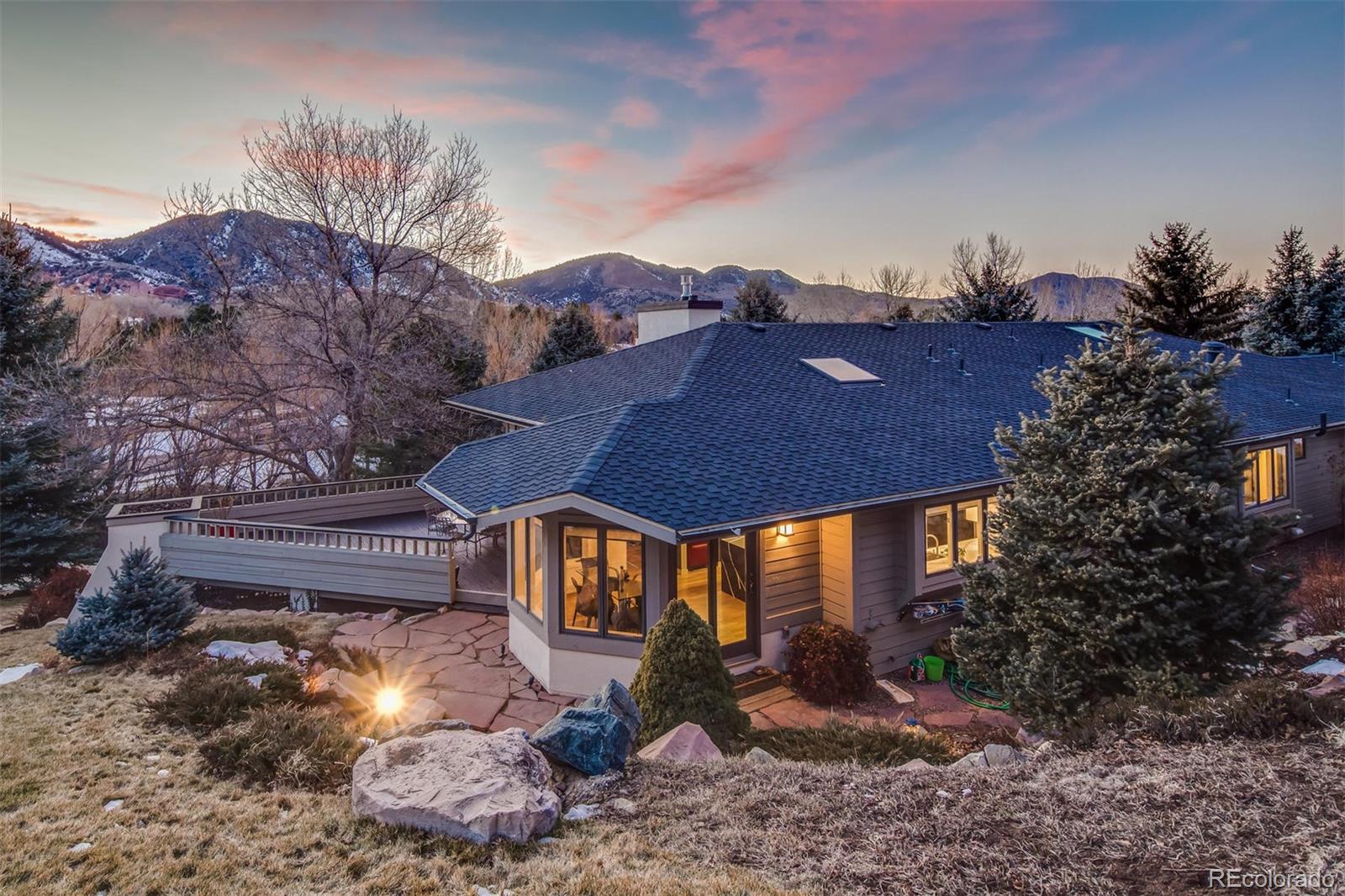 5852 Willowbrook Drive Morrison, CO 80465 - Photo 4 of 30 a view of a house with a yard and sitting area