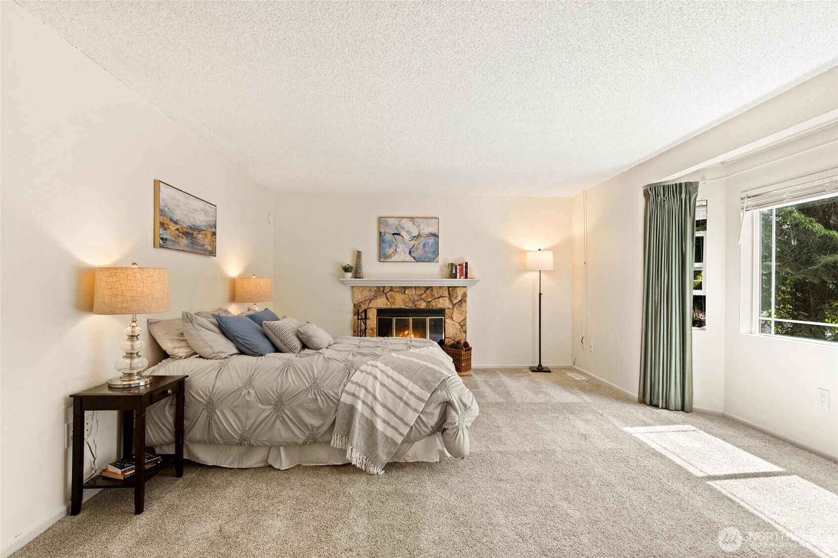 20817 29th Avenue Southeast Bothell, WA 98021 - Photo 20 of 40 a bedroom with a bed and a lamp on table
