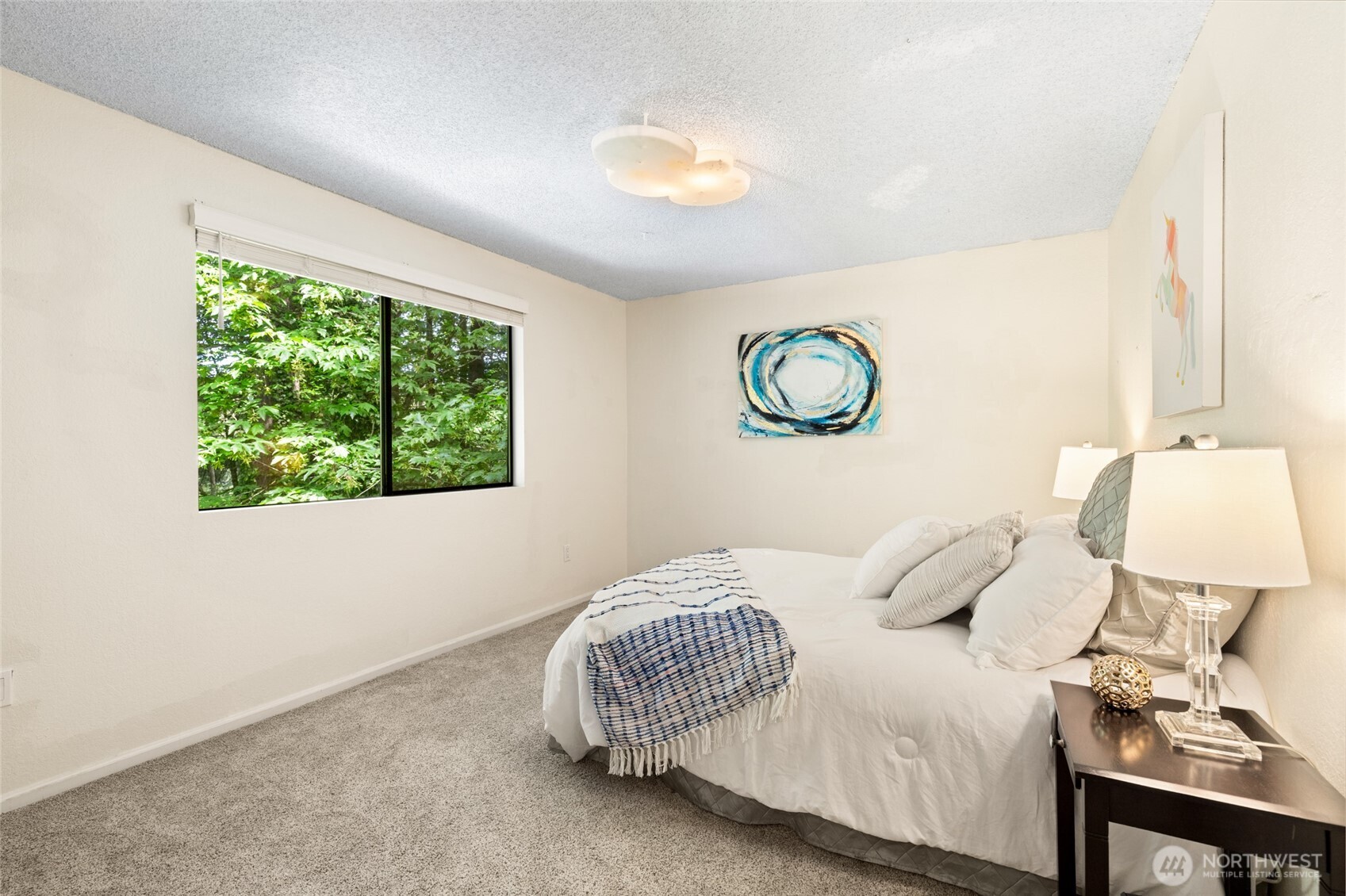 20817 29th Avenue Southeast Bothell, WA 98021 - Photo 26 of 40 a bedroom with a bed and a window