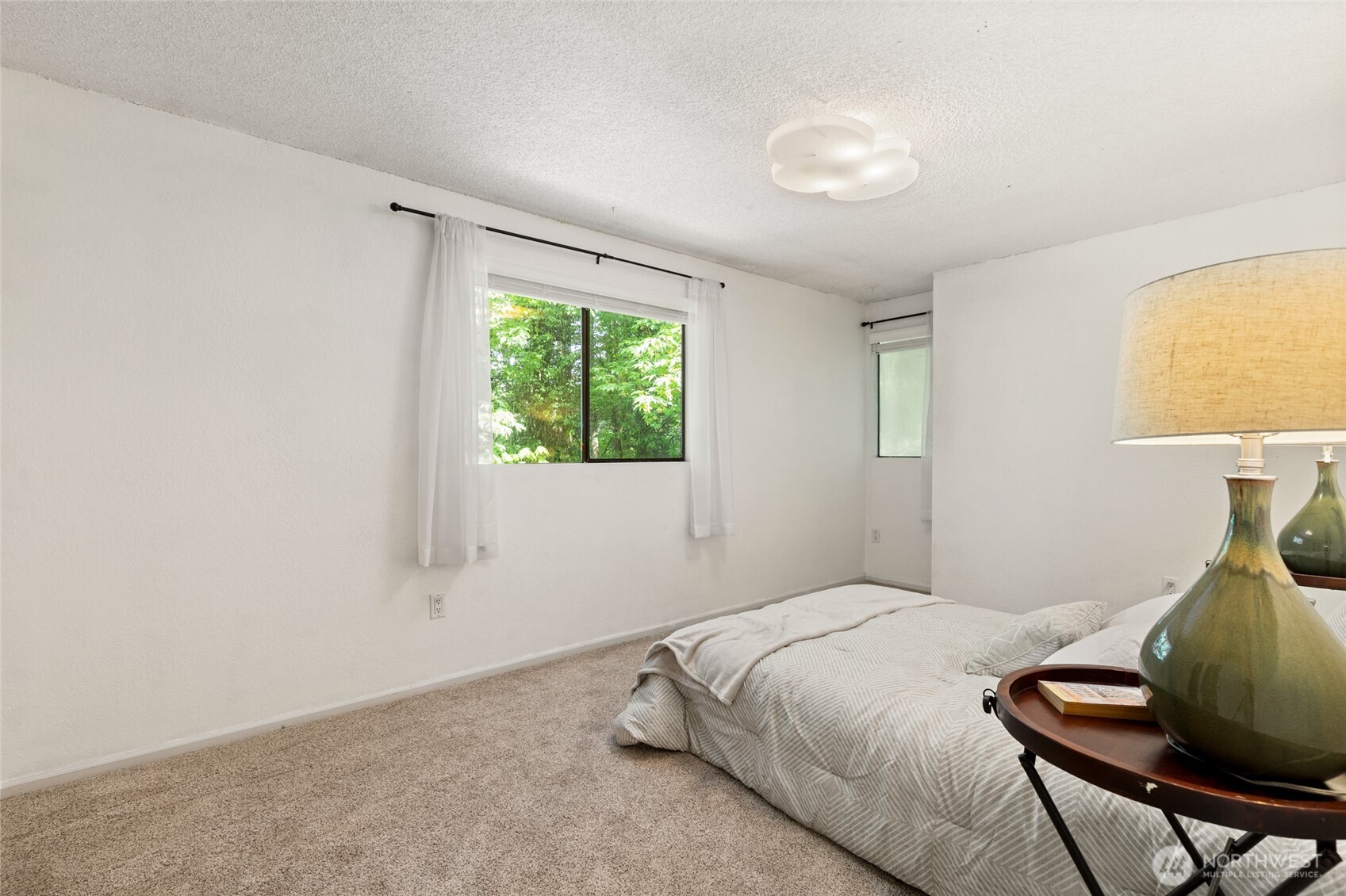 20817 29th Avenue Southeast Bothell, WA 98021 - Photo 28 of 40 a bedroom with a bed and window