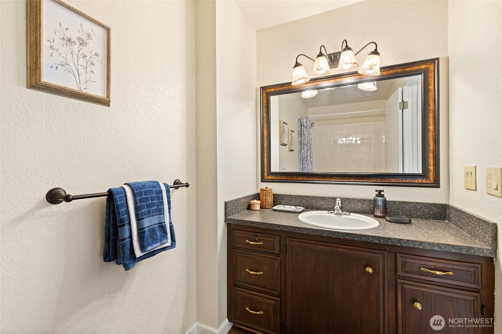 20817 29th Avenue Southeast Bothell, WA 98021 - Photo 29 of 40 a bathroom with a sink and a mirror