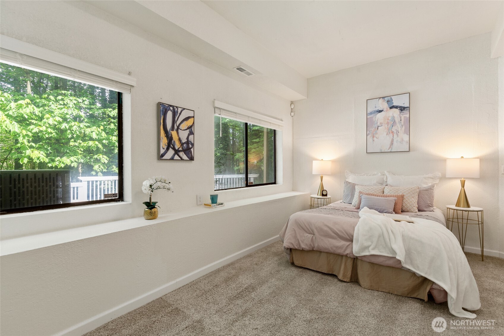 20817 29th Avenue Southeast Bothell, WA 98021 - Photo 33 of 40 a spacious bedroom with a bed and a large window