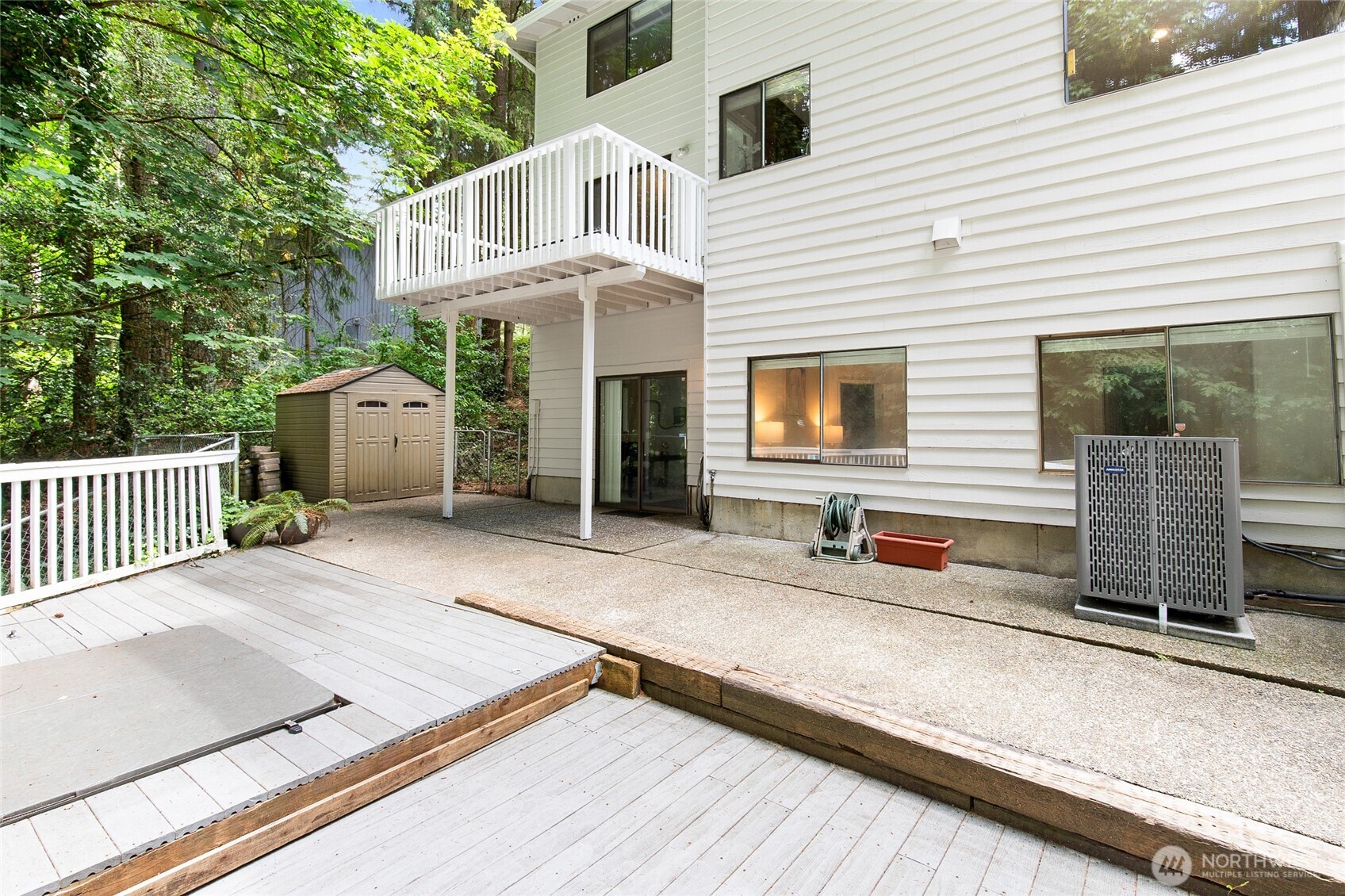 20817 29th Avenue Southeast Bothell, WA 98021 - Photo 39 of 40 a front view of a house with barbeque and wooden fence