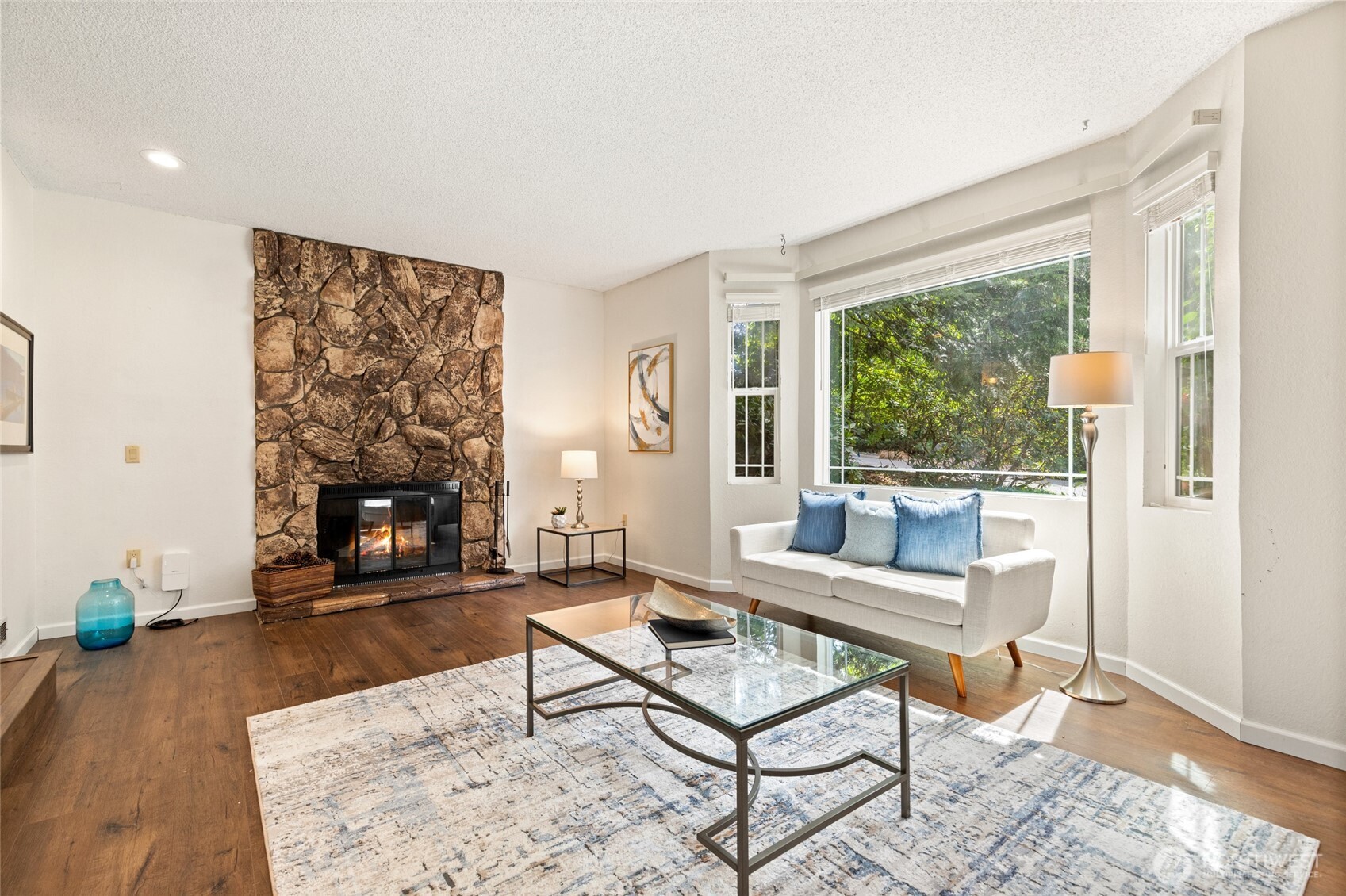 20817 29th Avenue Southeast Bothell, WA 98021 - Photo 5 of 40 a living room with furniture and a fireplace