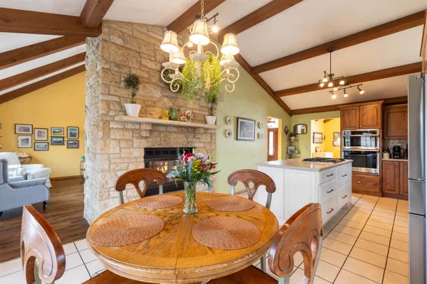 a fireplace with a stove and a table