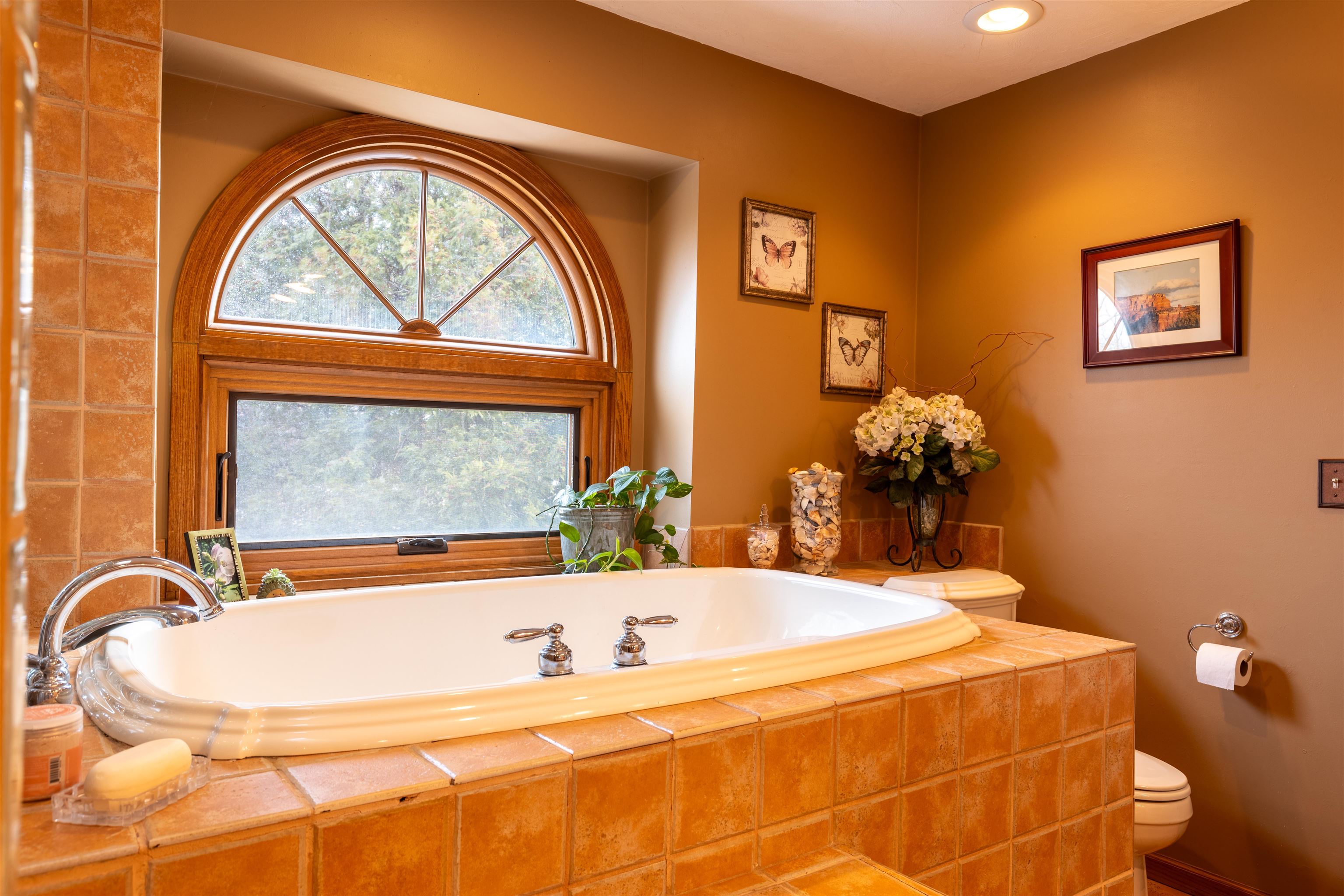 24 Butternut Lane Galena, IL 61036 - Photo 36 of 61 a bathroom with a tub and a large window