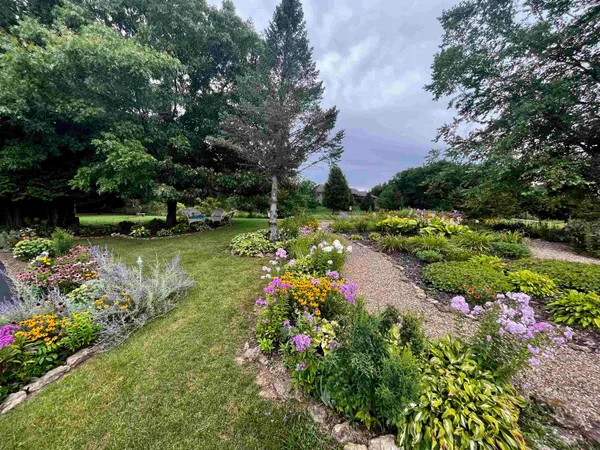 a bed room with furniture and a book shelf